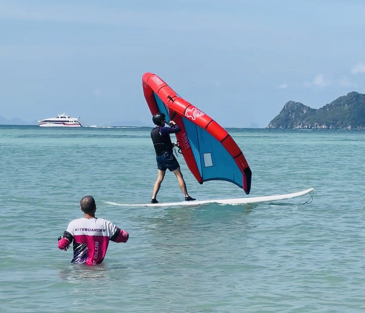 Learn wing foil at Koh Samui — IWO certified instructor coaching on flat water lagoon