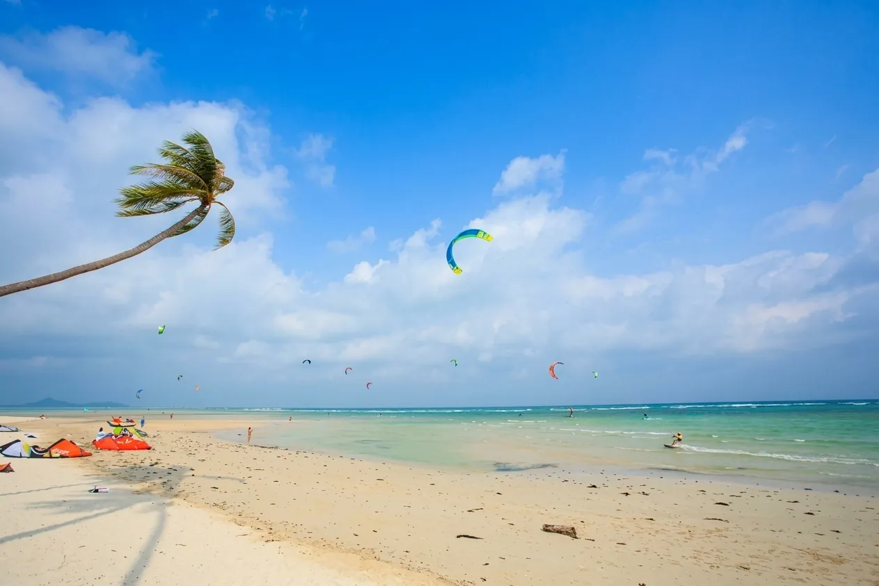 Kitesurfers at Nahai Beach, Koh Samui — our December–April spot